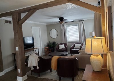 Finished livingroom with exposed support beams